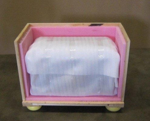 Packed and placed inside a customized wooden crate with interior padding