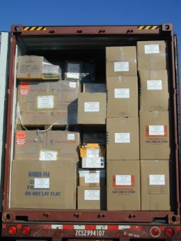 Packed household goods placed into a shipping container.