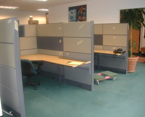 Office shelves emptied and packed into boxes